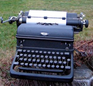 Old-fashioned typewriter, Royal brand, with blank paper