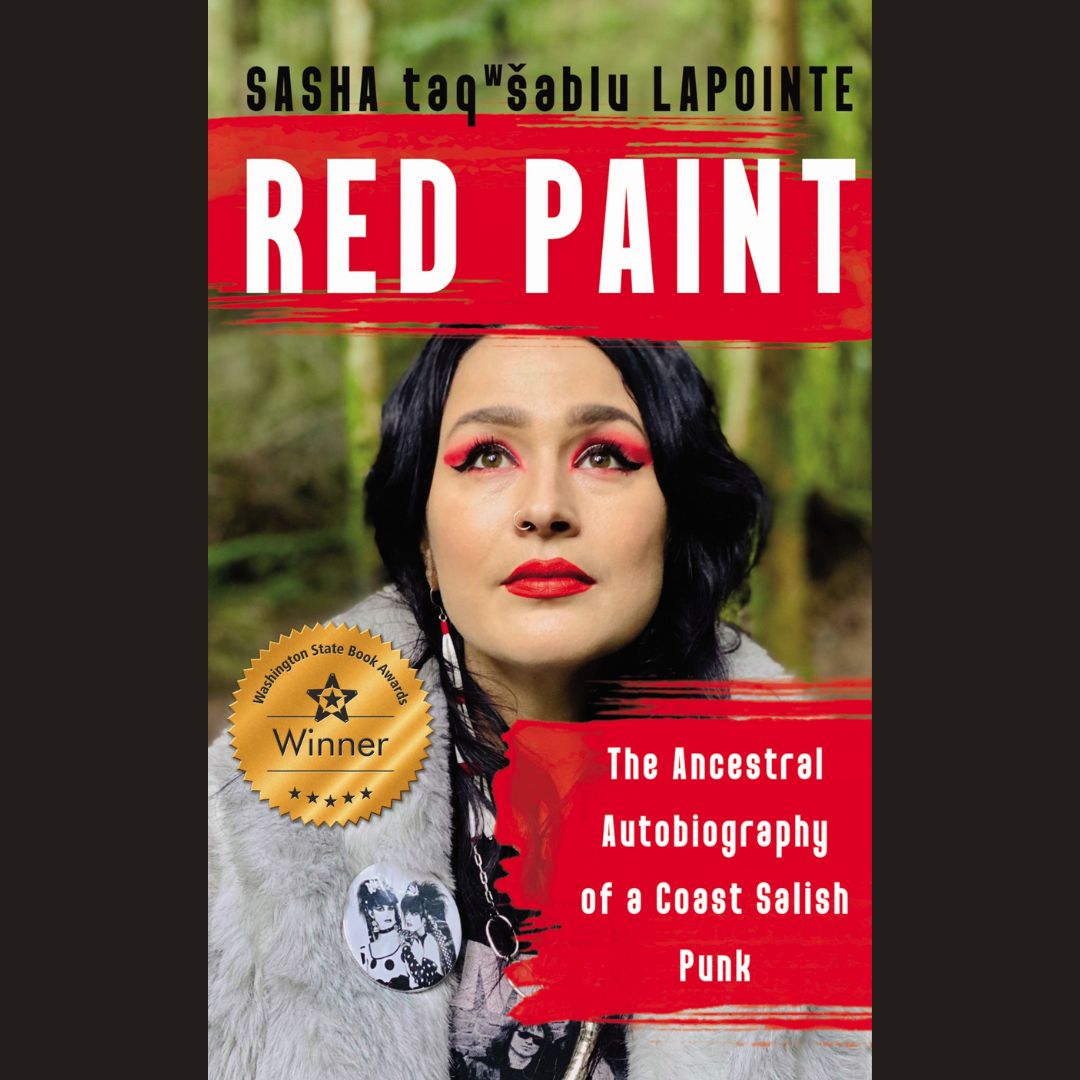 the book cover for red paint: the ancestral autobiography of a coast salish punk by Sasha taqʷšəblu LaPointe. the author, wearing red lipstick and eyeshadow is in a green nw forest